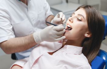 Woman undergoing dental checkup.