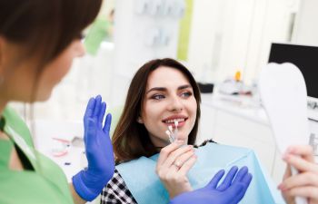 Dentist and patient choosing veneers.